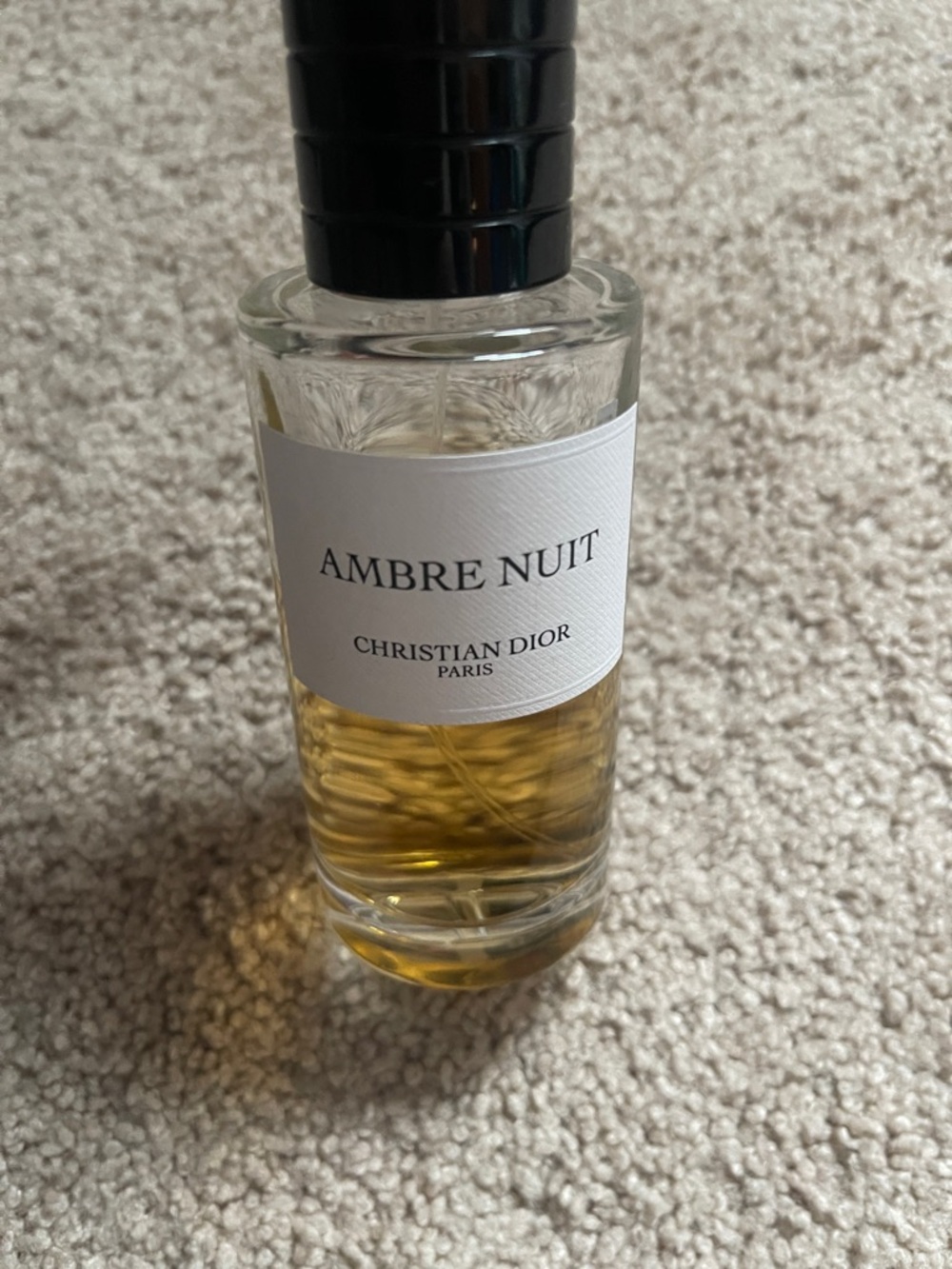 Dior Ambre Nuit Bottle in Clear Glass with Black Cap and Amber Liquid